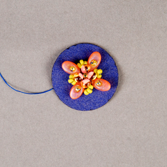 Adding seed beads to bead embroidery